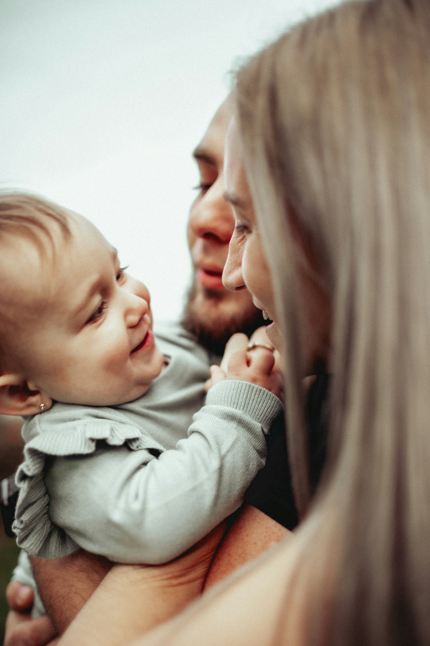 A parent holding a newborn baby